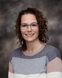 Fremont City Schools Board of Education Member Lori Bloom in front of a colored background